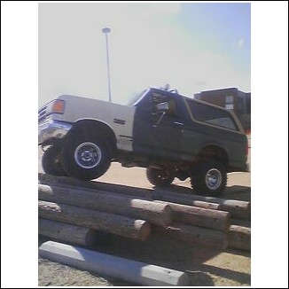 1989 Ford Bronco - bronco after front clip change, lift 33's aluminum holeshots poser pic on power poles