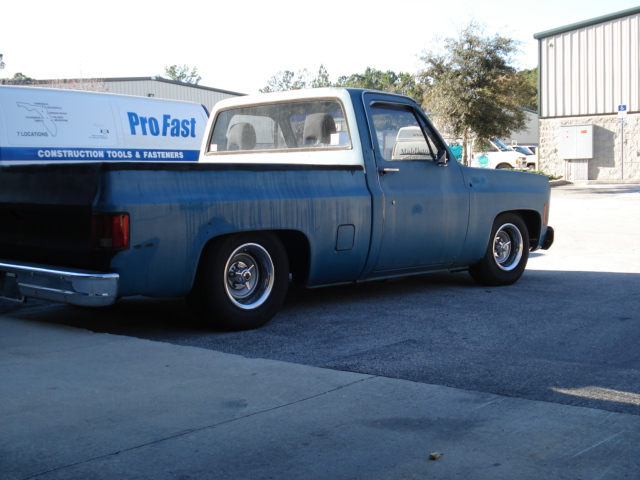Lowered blue and white 1970s Chevrolet C/K pickup truck side view.