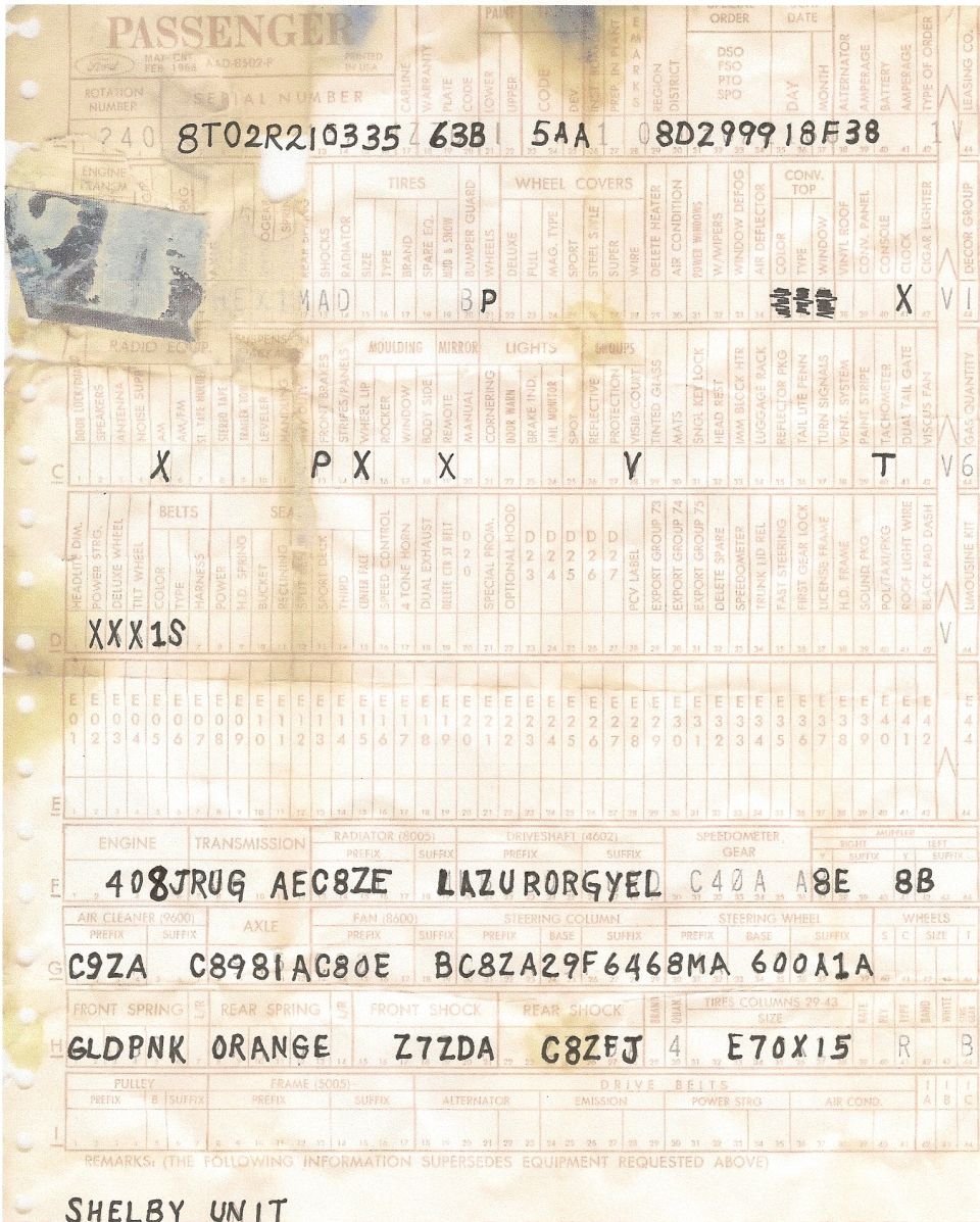Close-up of a vehicle data plate with handwritten specifications.