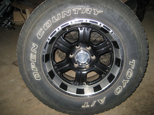 Toyo Open Country A/T tire on a black aftermarket wheel