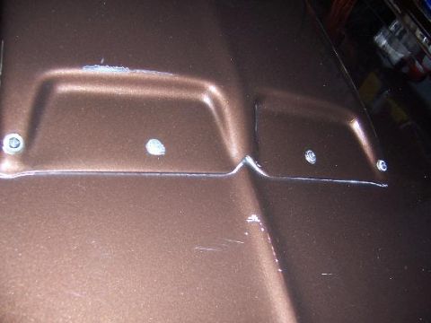 1975 Ford Granada - back of hood scoop mounted by 4 self-tapping screws with rubber washers