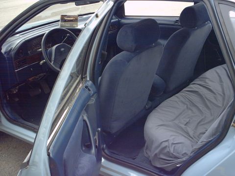 1986 Ford Taurus - Interior view of a 1986 Ford Taurus, including the dashboard and seats.