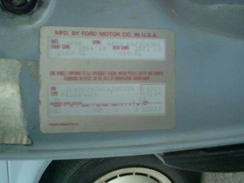 1986 Ford Taurus - A vehicle identification sticker shows the manufacturing date as April 1986.