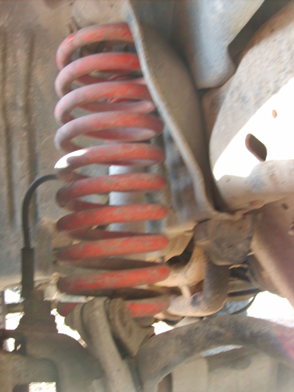 Red coil spring suspension on a 1989 Ford Bronco