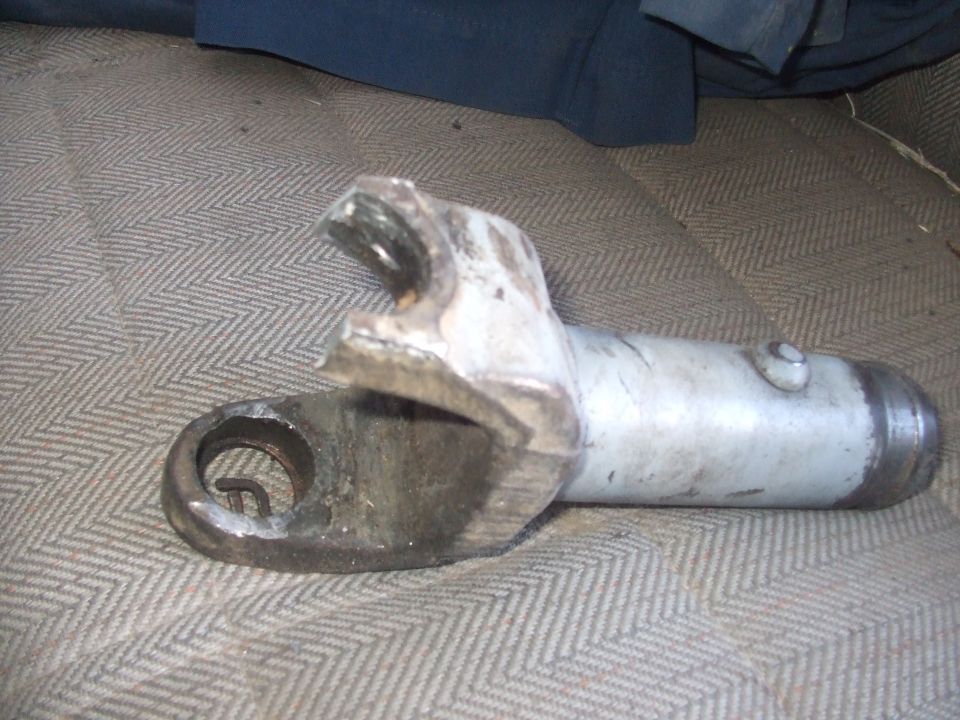 Close-up of a universal joint assembly on patterned fabric.