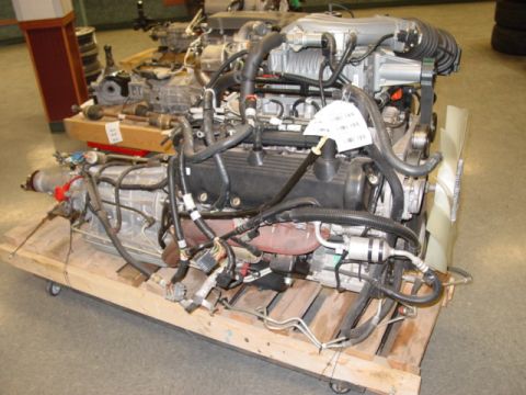 2007 Ford Mustang - Photograph of an engine and transmission on a pallet, not a technical document.