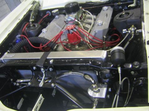 1969 Mercury Cyclone - Close-up view of a car's engine compartment, highlighting the V8 engine and its components.
