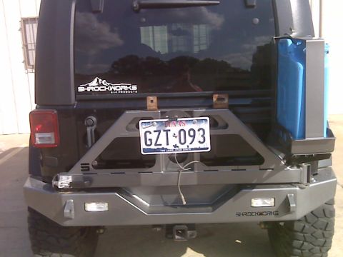 2008 Jeep Wrangler - Aftermarket rear bumper and spare tire carrier installed on a Jeep Wrangler.