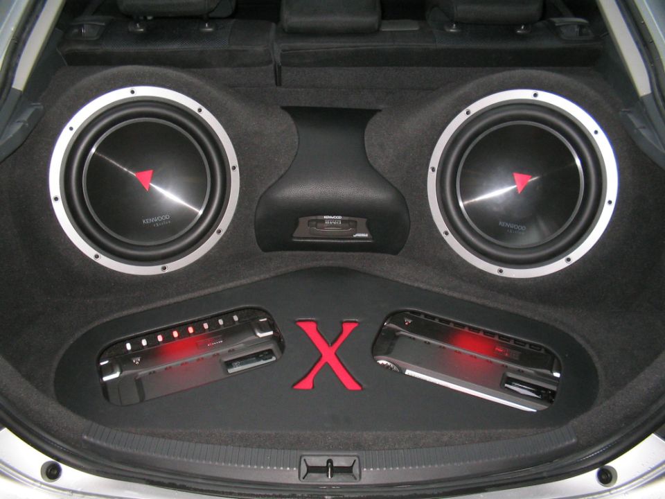 Custom trunk install with two Kenwood subs, two amps and a red X divider