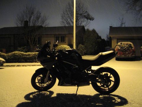 2008 Kawasaki Ninja R - Motorcycle parked outside in the snow at night.