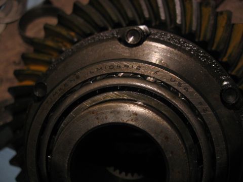 1989 Ford Bronco - Close-up of a differential gear and a Timken LM104912 bearing, showing internal automotive components.