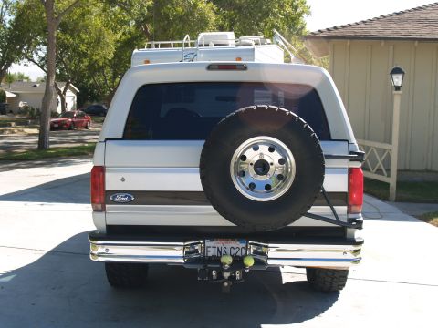 1993 Ford Bronco - This 1993 Ford Bronco is shown from the rear, its spare tire and a shiny chrome bumper.