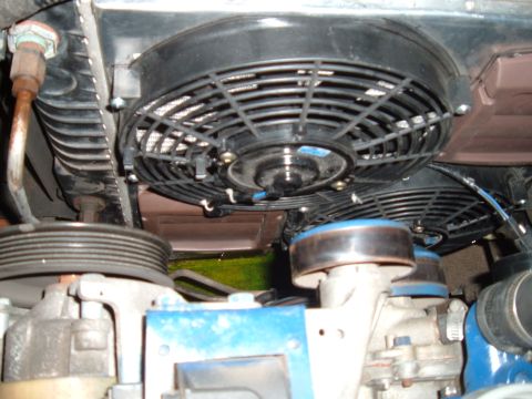 1990 Ford Ranger - Aftermarket electric cooling fans are installed in front of the radiator, with engine components visible below.