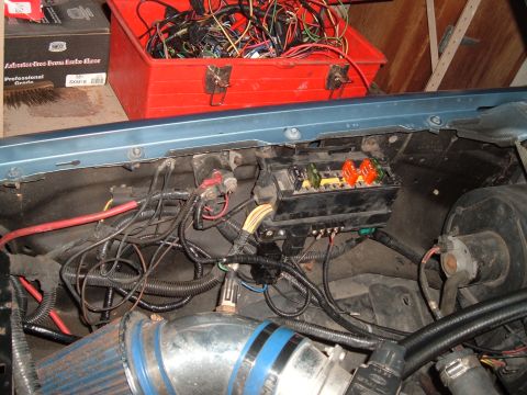 1990 Ford Ranger - Close-up view of a vehicle's engine bay, showing the fuse box and various electrical components.