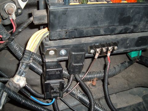 1990 Ford Ranger - Close-up view of an automotive electrical relay and fuse box with visible wiring and connectors.