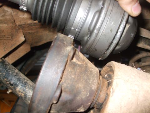 1996 Jeep Grand Cherokee - Close-up view of a CV joint and driveshaft connection, showing mechanical components.