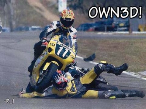 1972 Ford Ranchero - A motorcycle racer has crashed on the track, with another rider passing by.