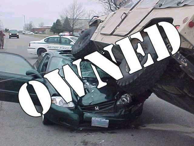 Green Honda sedan crushed under a military vehicle's tire, with 'OWNED' text overlay
