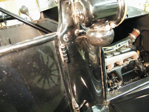 1915 Ford Model T - Close-up view of the engine and interior of a 1915 Ford Model T.