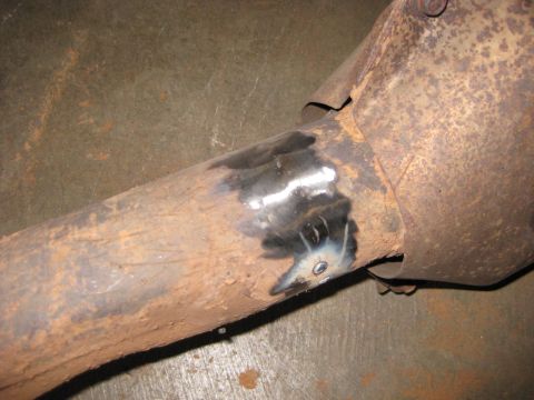 1995 Ford Bronco - Exhaust pipe section with a visible weld repair.