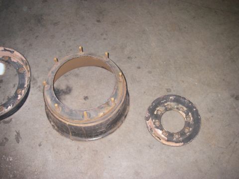 1978 Ford Bronco - Wheel hub components are laid out on a concrete surface, showing rust and wear.