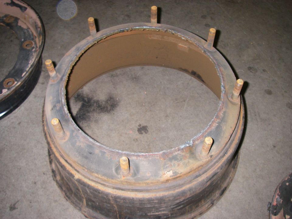 Wheel hub with multiple studs, showing rust and wear