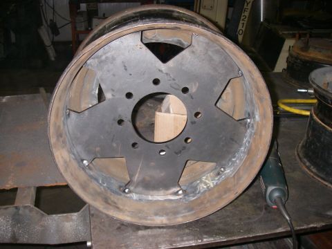 1978 Ford Bronco - A close-up view of a modified wheel rim, showing custom metalwork and welding details.