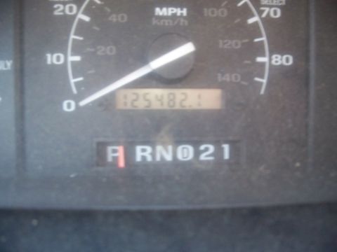 1977 Ford F-150 - The odometer shows 125,482.1 miles, and the gear selector is in reverse.