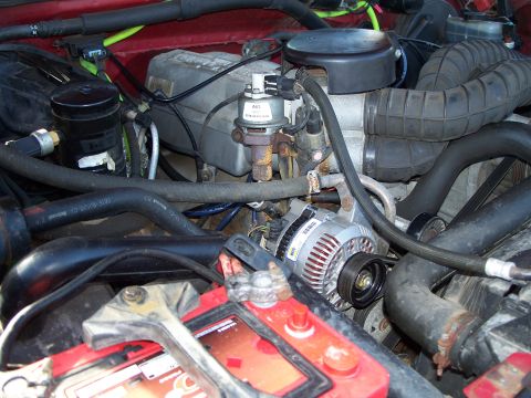 1977 Ford F-150 - Close-up view of a vehicle's engine bay, highlighting various components and wiring.
