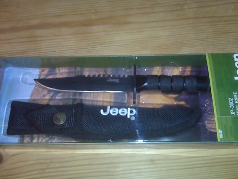 2008 Jeep Wrangler - Jeep branded trail knife with sheath, model JP-3002, shown in its original packaging.