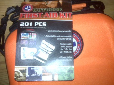 2008 Jeep Wrangler - An outdoor first aid kit is shown with its product tag detailing its contents and features.