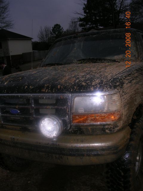 1994 Ford Bronco - This truck is covered in mud, suggesting it has been off-roading.