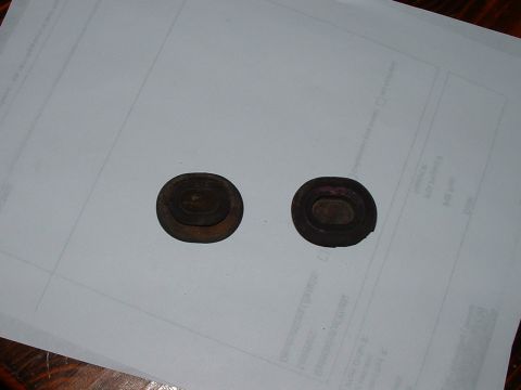 1978 Ford Ranchero - Two rubber grommets are shown on a document.