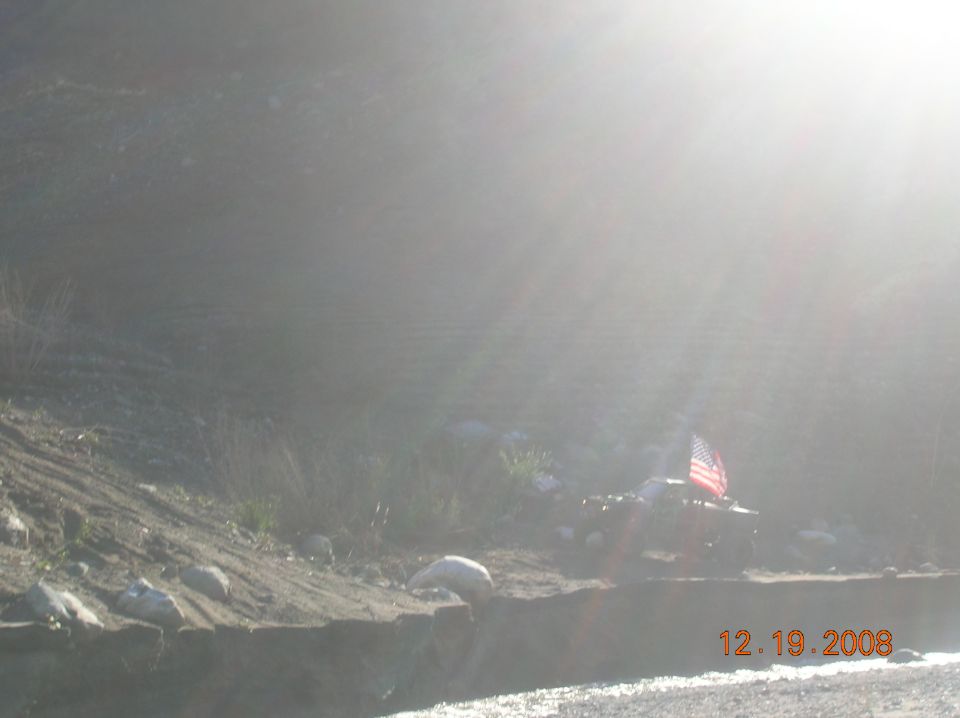 Red SUV with American flag on its rear