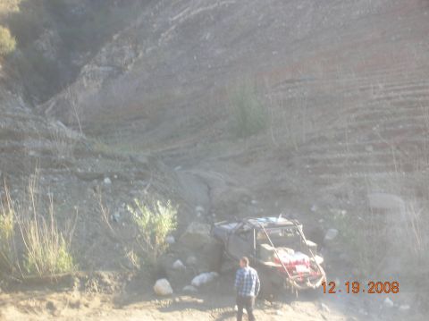 1985 Ford Bronco - A person stands next to an off-road buggy on a steep, muddy incline. The date 12.19.2008 is visible.