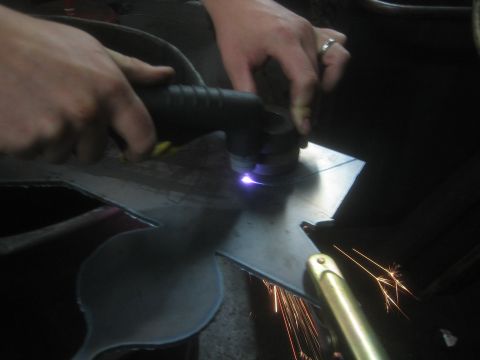 1990 Ford Bronco - Photograph of metal fabrication in progress, not a technical document.