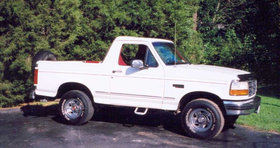 White 1993 Ford Bronco, 3/4 front view, with spare tire mounted on rear