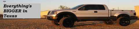 1979 Ford Bronco - A lifted, silver four-door pickup truck with black fender flares and large black wheels is parked on a gravel lot. Text on a light gray bac…