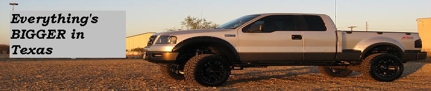 Lifted silver pickup truck with "Everything's BIGGER in Texas" text.