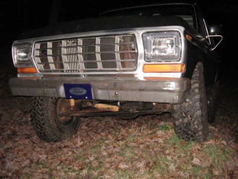 1978 Ford Bronco - This Ford truck features a prominent chrome grille and bumper, with a blue Ford license plate frame visible.