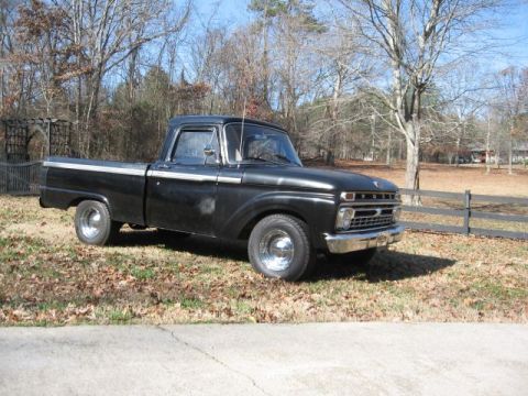 1966 Ford F-100 - 1966 Ford F-100 pickup truck with chrome wheels and trim, seen outdoors.