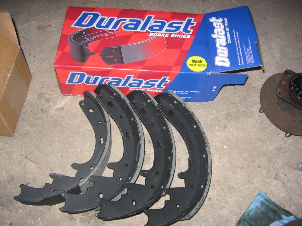 Duralast brake shoes and box on a garage floor