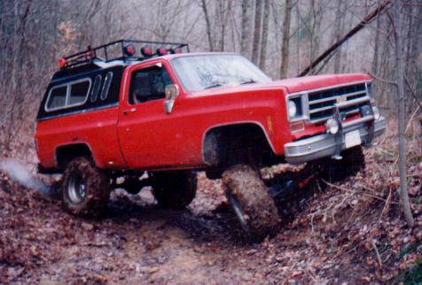 1982 Ford Bronco - Not bad for just aftermarkert superlift springs. This is Big RED, my bros old 77 chevy. Man that camper top is ugly.