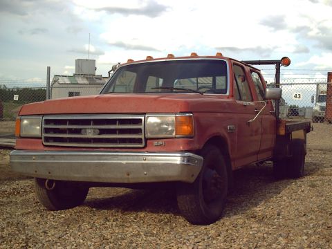 1988 Ford F-350 - This 1988 Ford F-350 flatbed truck is seen from the front 3/4 angle.