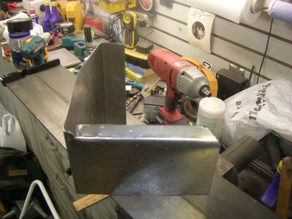 Workbench with tools and a metal bracket