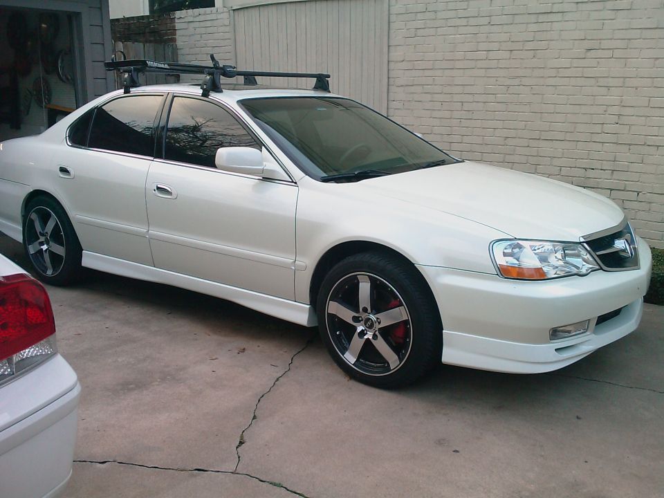 White 2003 Acura TL sedan with roof rack and custom wheels