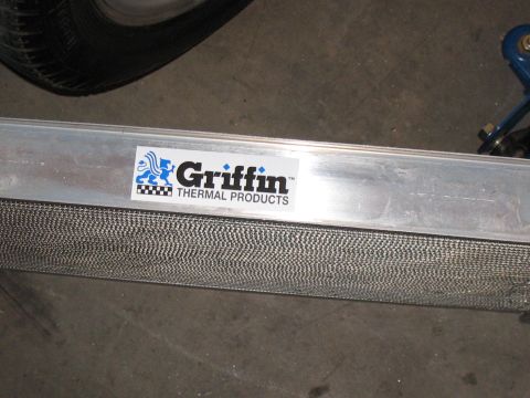 2001 Pontiac Trans Am - Close-up of a Griffin Thermal Products radiator, showing the brand's sticker and part of a tire.