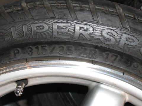 2001 Pontiac Trans Am - Close-up of a tire and wheel assembly, showing tire size information.
