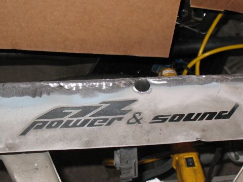 2001 Pontiac Trans Am - A close-up shows the "GZ Power & Sound" branding on a vehicle part.