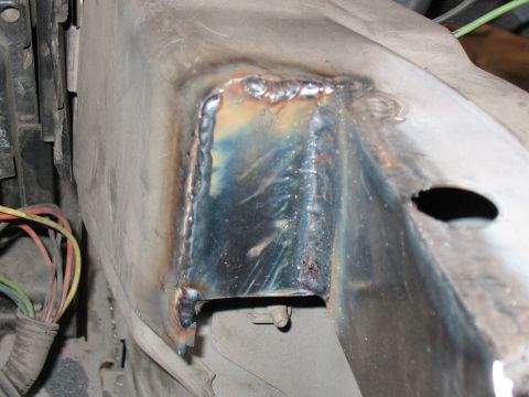 2001 Pontiac Trans Am - Welded metal bracket with electrical wires visible, likely part of a vehicle's chassis or engine bay.